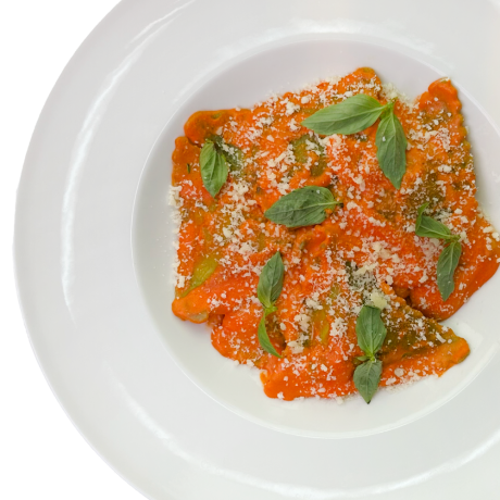 Ravioli with salmon, spinach with romesco sauce